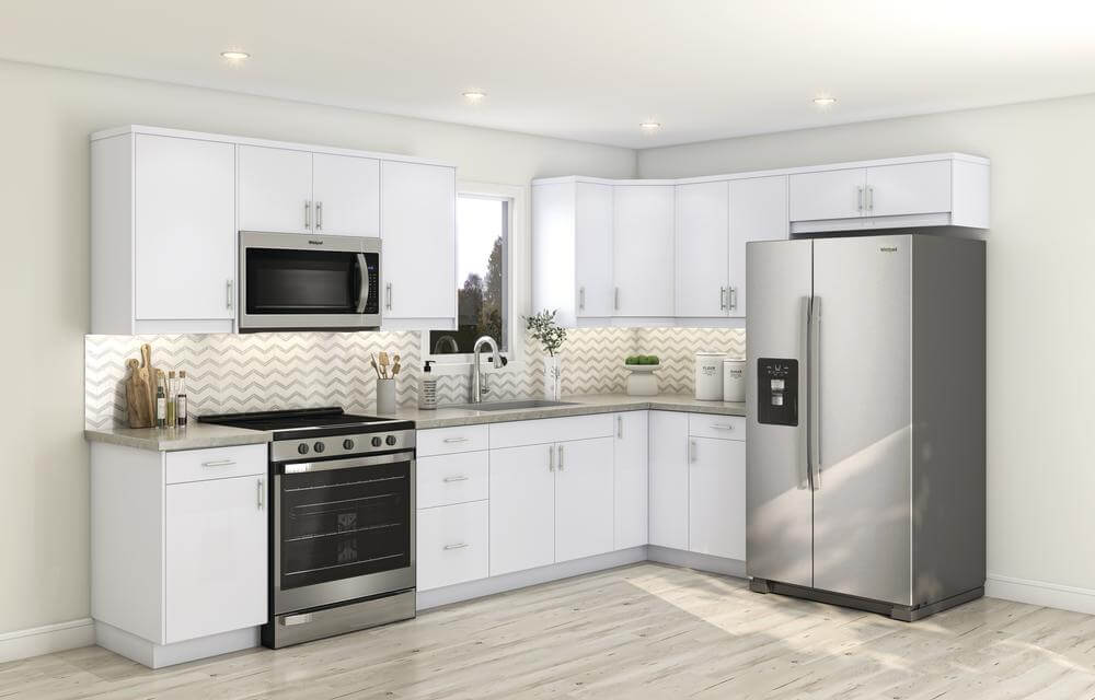 Finished L-shaped kitchen with white cabinetry, stainless steel appliances, and under-cabinet lighting